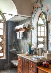 a bathroom with a sink and a mirror at LohonoStays Calisto Villa E in Camorlim +16 photos