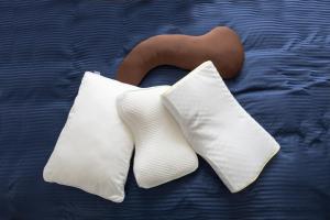 two white pillows on a bed with a brown object at Mito Hotel Season in Mito +23 photos
