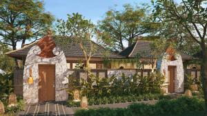 a small house with a stone face at Avala Nusa Dua Bali in Bali Nusa Dua