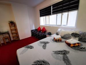 a bedroom with a bed and a couch at 2B-03 Condo Staycation at Megatower 1 in Baguio