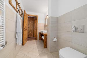 a bathroom with a toilet and a sink at Maison Carrel Elegant 6 in Breuil-Cervinia +34 photos