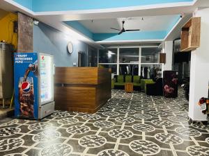 a living room with a lobby with a couch at Hotel ANR Grand in Visakhapatnam