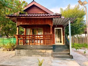 a small house with a porch and stairs to it at Kohrong Central Beach in Koh Rong Island