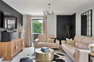 a living room with a couch and a table at Finest Retreats - Orchard Rise in Bude