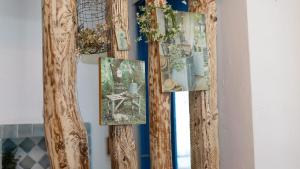 a group of pictures hanging on a wall at Ganghwa Picnic Pension in Incheon +2 photos