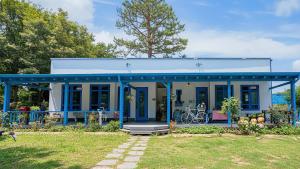 a blue house with a blue roof at Ganghwa Picnic Pension in Incheon
