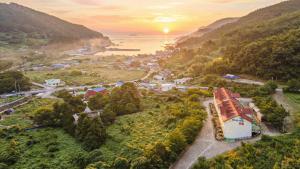 an aerial view of a small town in a mountain at Tongyoung Macaio Pension in Tongyeong