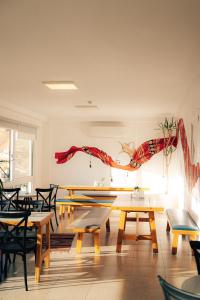 a restaurant with tables and chairs in a room at Nomads Hotel in Wadi Musa