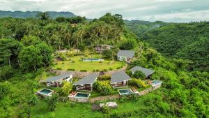 an aerial view of a house in the forest at EDEN Private Pool Suites and Panoramic Agung View - ADULT ONLY in Nusa Penida