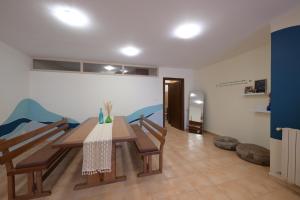 a dining room with a table and chairs at Chalets in Arez - Adagio in Al Arz
