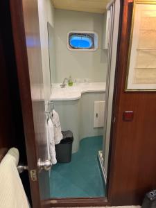 a bathroom with a sink and a tub and a mirror at Meridian bleu in Salamina +43 photos
