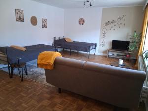 a living room with a couch and a bed at Apartment Aigner in Reisbach