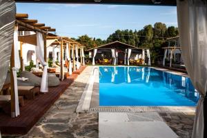 a swimming pool with a pavilion and a swimming pool at Zografia View in Corfu
