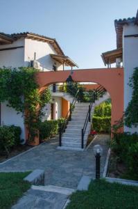 a stairway leading to a building with an archway at Zografia View in Corfu