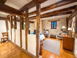 a room with a bed and a desk at LE CLOS DU BENESTAR in Mauvezin-dʼArmagnac