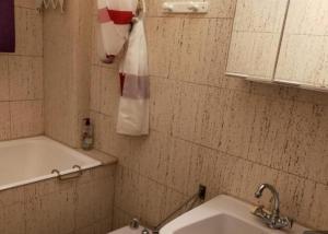 a bathroom with a sink and a towel on the wall at Mandala in Vars