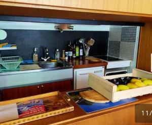 a kitchen with a counter with a box of food at Mandala in Vars