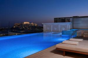 a large swimming pool on the roof of a building at King George, a Luxury Collection Hotel, Athens in Athens