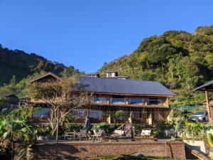 a house on the side of a mountain at Charming Home Tà Xùa in Bắc Yên