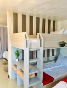 a bunk bed in a room with a bunk bedutenewayangering at JULIA'S PLACE HOTEL Dangcagan - Bukidnon in Dancagan
