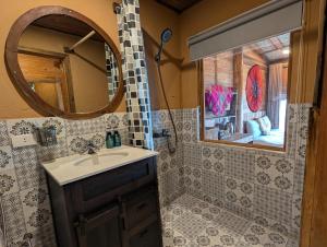 a bathroom with a sink and a mirror at Charming Home Tà Xùa in Bắc Yên +164 photos