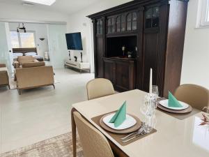 a dining room with a table and a living room at LOFT - Exclusive Penthousewohnung in Könen