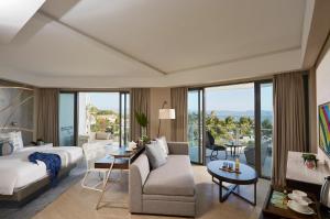 a living room with a bed and a couch at The Lind Boracay in Boracay +44 photos