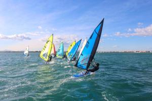a group of sailboats in the ocean on the water at Cosy Flat Catarroja in Catarroja