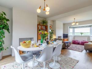 a living room with a table and chairs at 3 Bed in Kings Lynn oc-82358 in Harpley