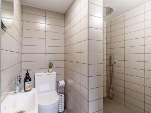 a bathroom with a toilet and a sink at 3 Bed in Kings Lynn oc-82358 in Harpley +17 photos