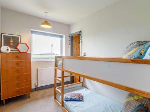 a bedroom with a bunk bed and a window at 3 Bed in Kings Lynn oc-82358 in Harpley