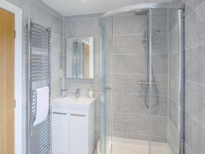a bathroom with a shower and a sink at 5 Bed in Market Rasen oc-78678 in Tealby +24 photos