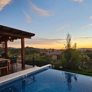 a swimming pool with a view of the mountains at Casa Brisa Chivato in Chivato