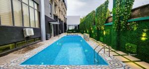 a swimming pool in the middle of a building at Cathelea Convention & Suites in Benin City
