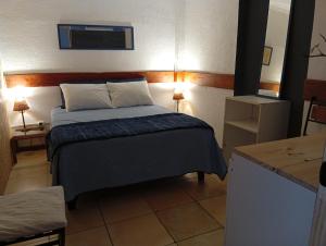 a bedroom with a bed in a small room at 566 Hostel in La Serena