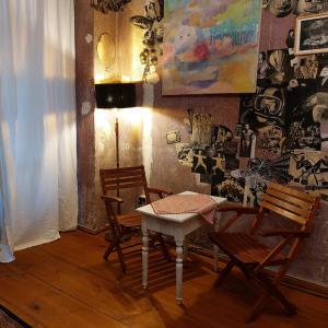 a dining room with a table and two chairs at Crystal Ball Residency in Berlin