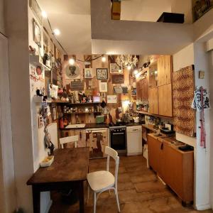 a kitchen with a table and chairs in it at Crystal Ball Residency in Berlin