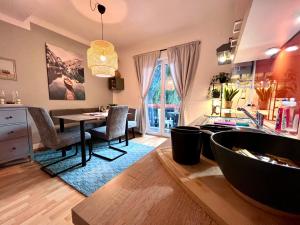a kitchen and dining room with a table and chairs at Joes cozy Apartment in Payerbach