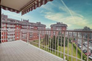 a balcony with a view of a parking lot at Assago Forum Apt - 3 min Walk in Assago
