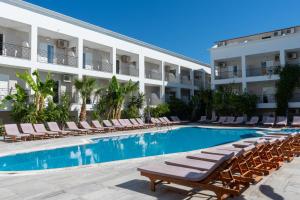 a swimming pool in front of a hotel at Mojo Hotel Laganas Zante in Laganas +37 photos
