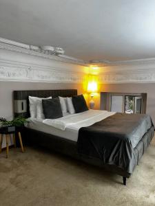 a bedroom with a large bed in a room at LevelUp ApartHotel in Baku