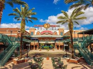 a large building with palm trees in front of it at Romantic Suite in Tampa