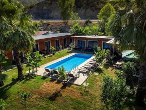 an aerial view of a house with a swimming pool at Terra Garden Hotel in Kemer