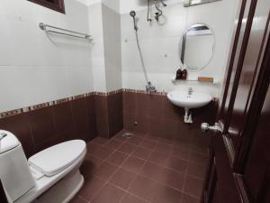 a bathroom with a toilet and a sink at The Cloud Hotel in Da Lat