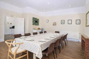 a large dining room with a table and chairs at Spacious Buxton house with hot tub and pool table in Norwich