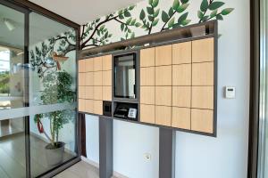 a room with a partition with a tv in it at Hotel Park Superior 3* in Čakovec