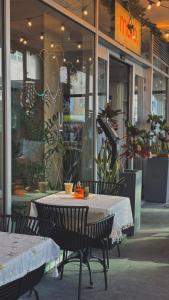 a table and chairs sitting in front of a store at Ultra Tel Aviv Boutique Hotel in Tel Aviv