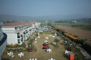 an aerial view of a resort with tables and chairs at Namaste Corbett Resort and Spa in Jāmb