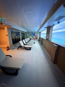 a row of lounge chairs on a cruise ship at Apartman Radmila in Kopaonik