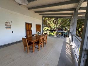 a wooden table and chairs on a patio at Casa Susen in Montezuma